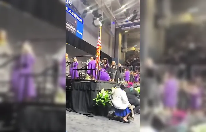 Girl gets KICKED in head during graduation backflip