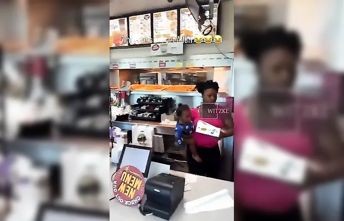 Woman goes behind counter to take chicken, uses baby as human meat shield