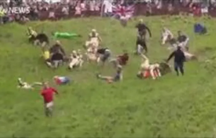 Man goes AIRBORN chasing a cheeseball down steep 200-yard hill