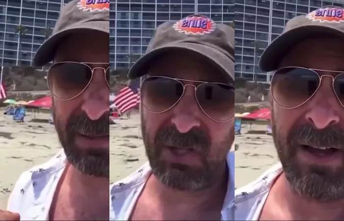 Guy gets triggered over American flags on the beach