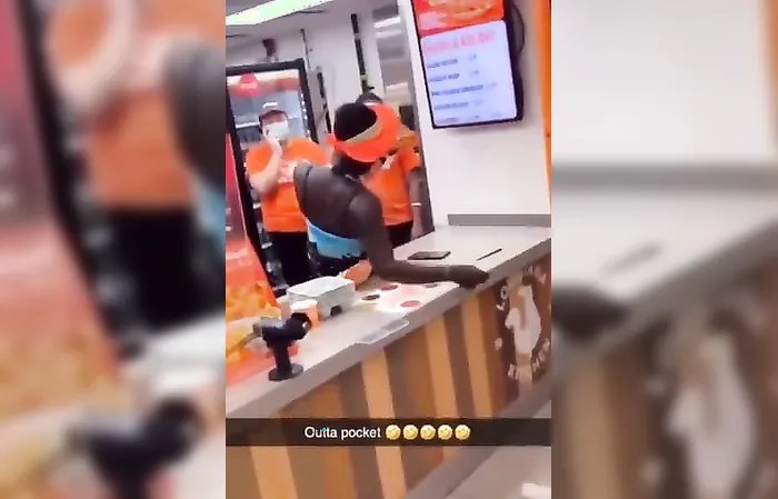 Woman climbs over counter for free chicken
