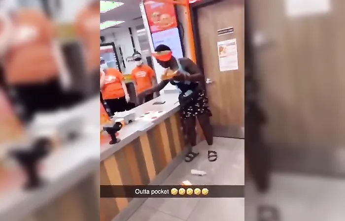 Woman climbs over counter for free chicken