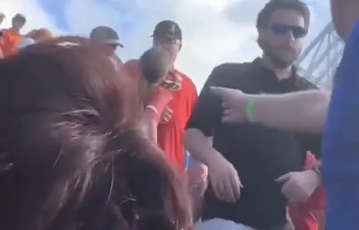 Guy picks up girlfriend by the pants to stop a fight