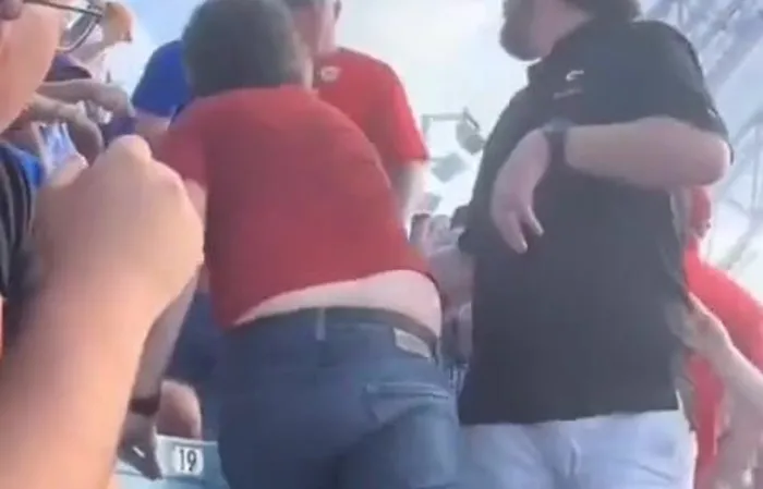 Guy picks up girlfriend by the pants to stop a fight