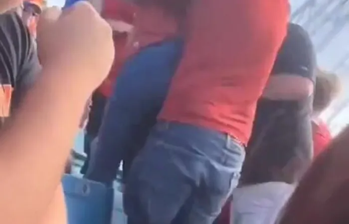 Guy picks up girlfriend by the pants to stop a fight