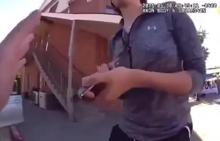 Woman drives through a festival to get to work