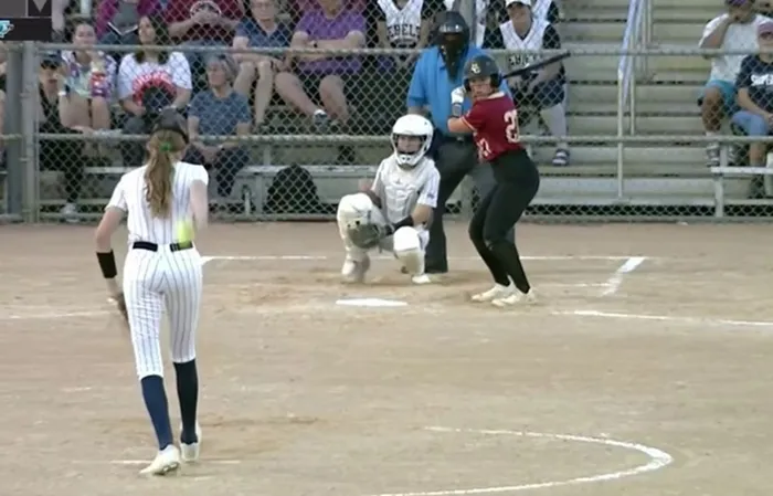Male softball pitcher dominates female players