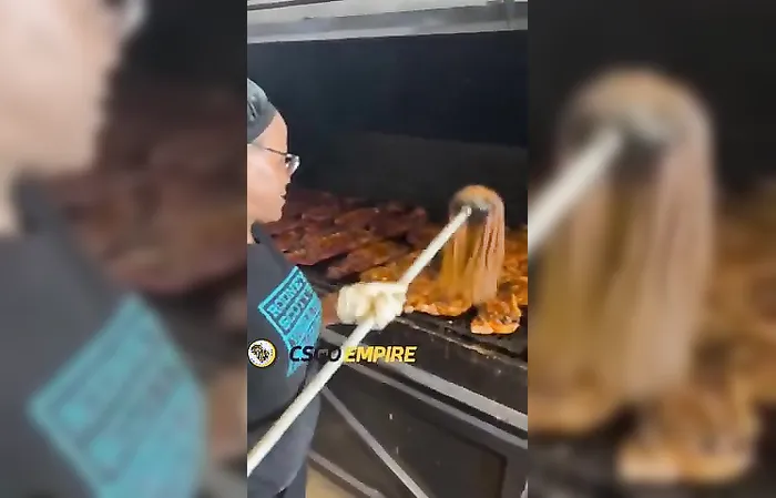 Woman MOPS the food on her grill