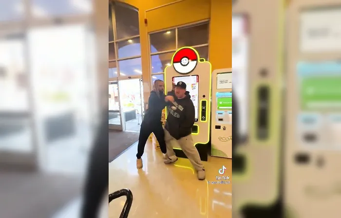Two grown men fight over Pokémon cards