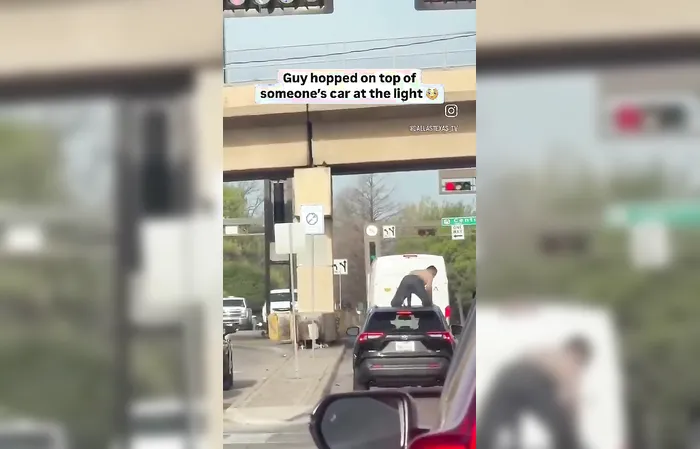 Man jumps on stranger's car in traffic
