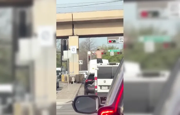 Man jumps on stranger's car in traffic