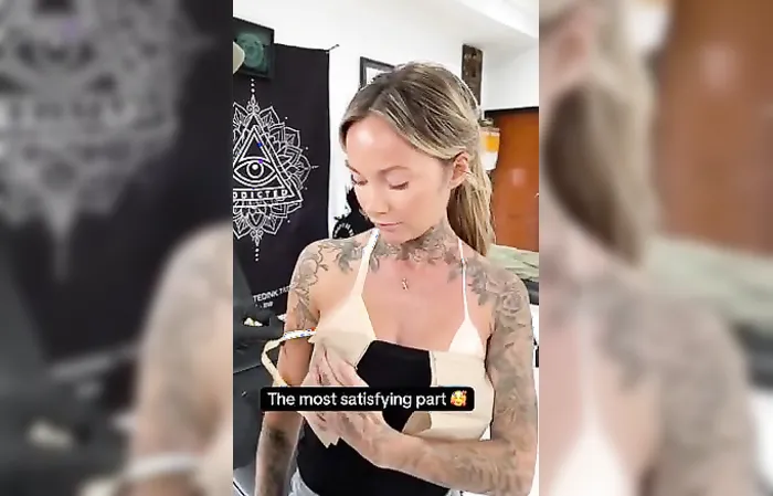 Woman has tan lines tattooed