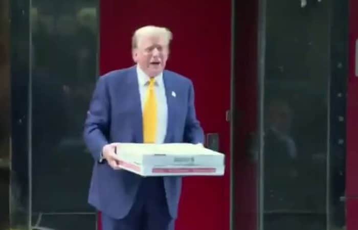 Trump brings the pizza, gets all the cheers