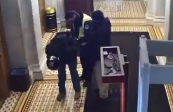 Video of Capitol police uncuffing someone, then Fist-Bumping still raises questions